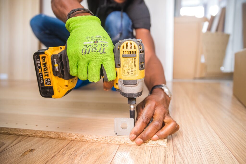 woodworker using impact driver on wood